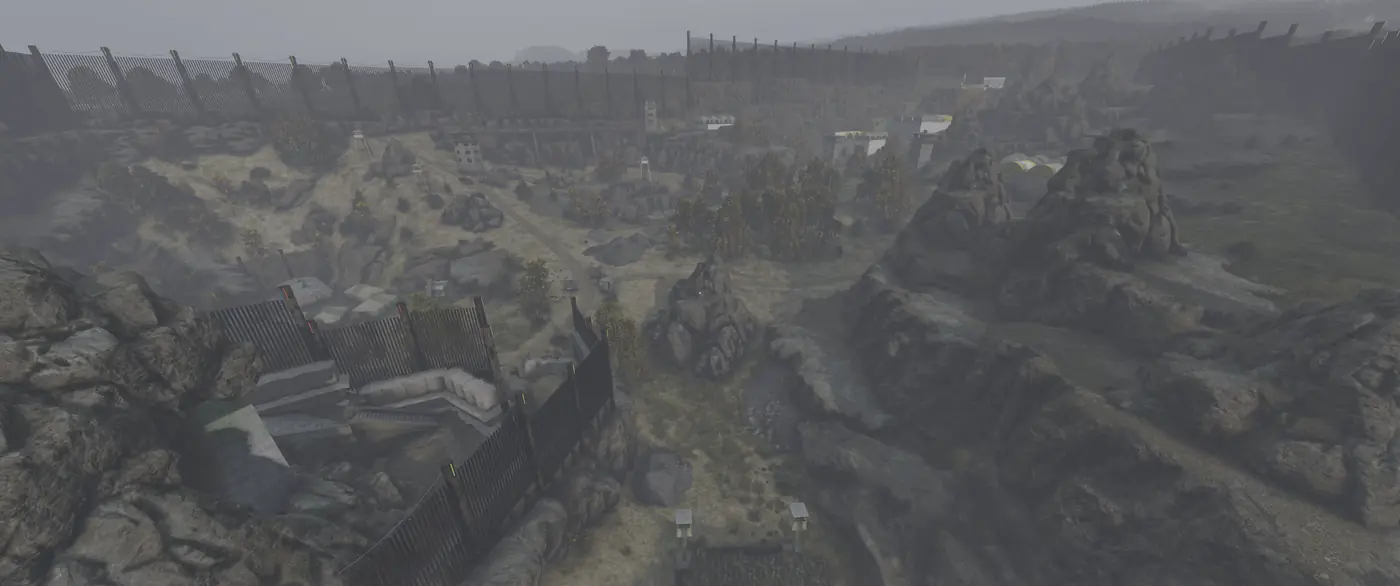 Aerial view of a fenced-off zone of watchtowers and bunkers hidden among canyon rocks on Is Dead