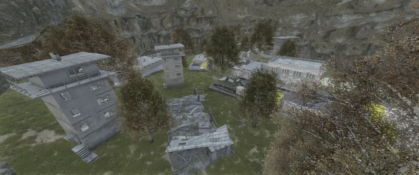 A walled-off custom area with watchtowers and barracks hidden in a rocky canyon on an Is Dead DayZ server
